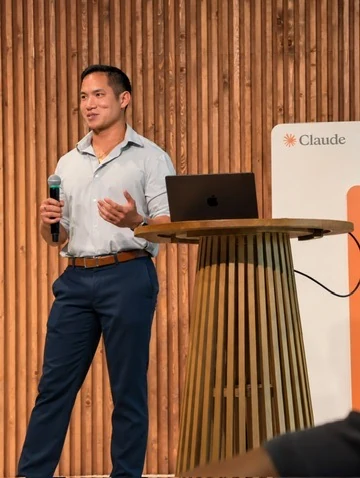 A coach presenting at an Anthropic event