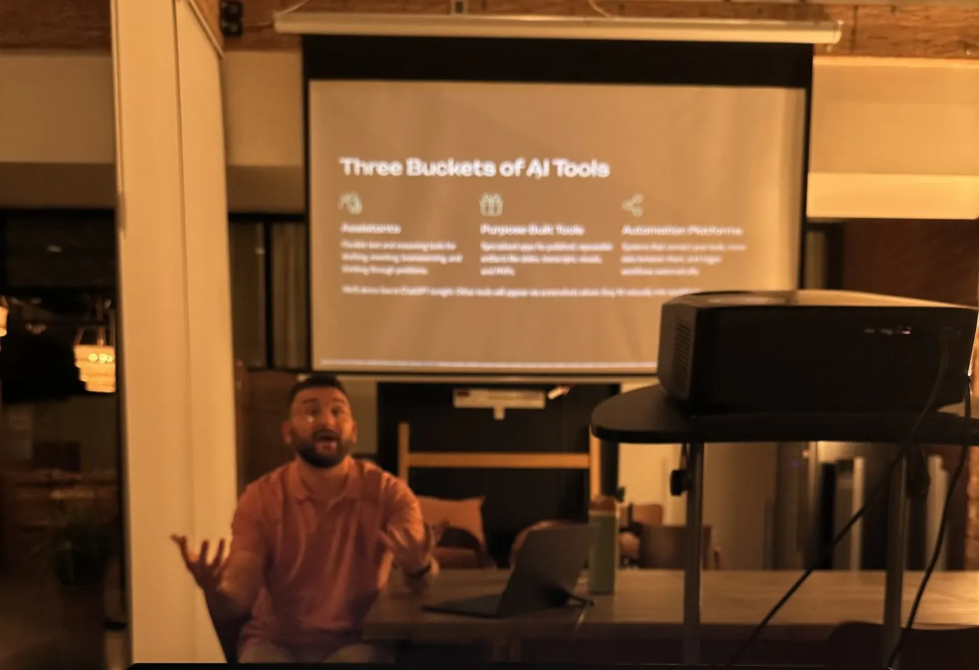 A coach explaining the three buckets of AI tools in a dim room